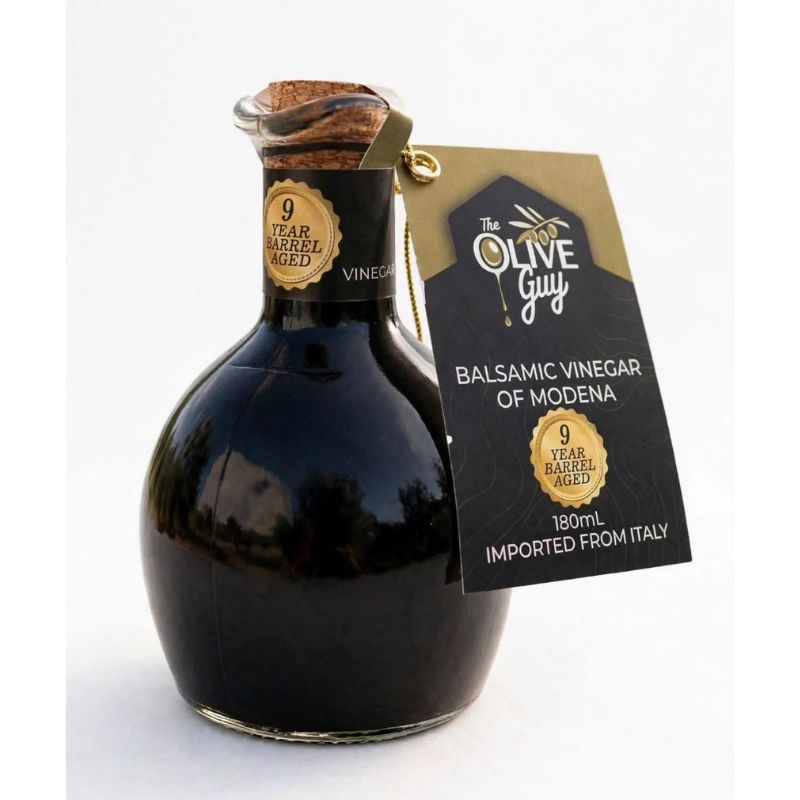 A 180ml decorative glass bottle of The Olive Guy 9-year barrel aged Balsamic Vinegar of Modena imported from Italy